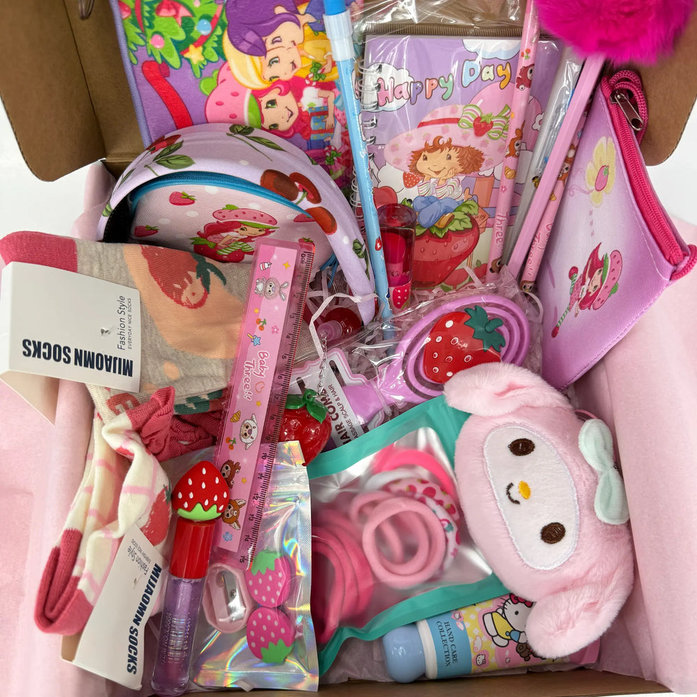 22-piece Kawaii Strawberry Gift Box for girls with pink stationery, beauty items, and school accessories.