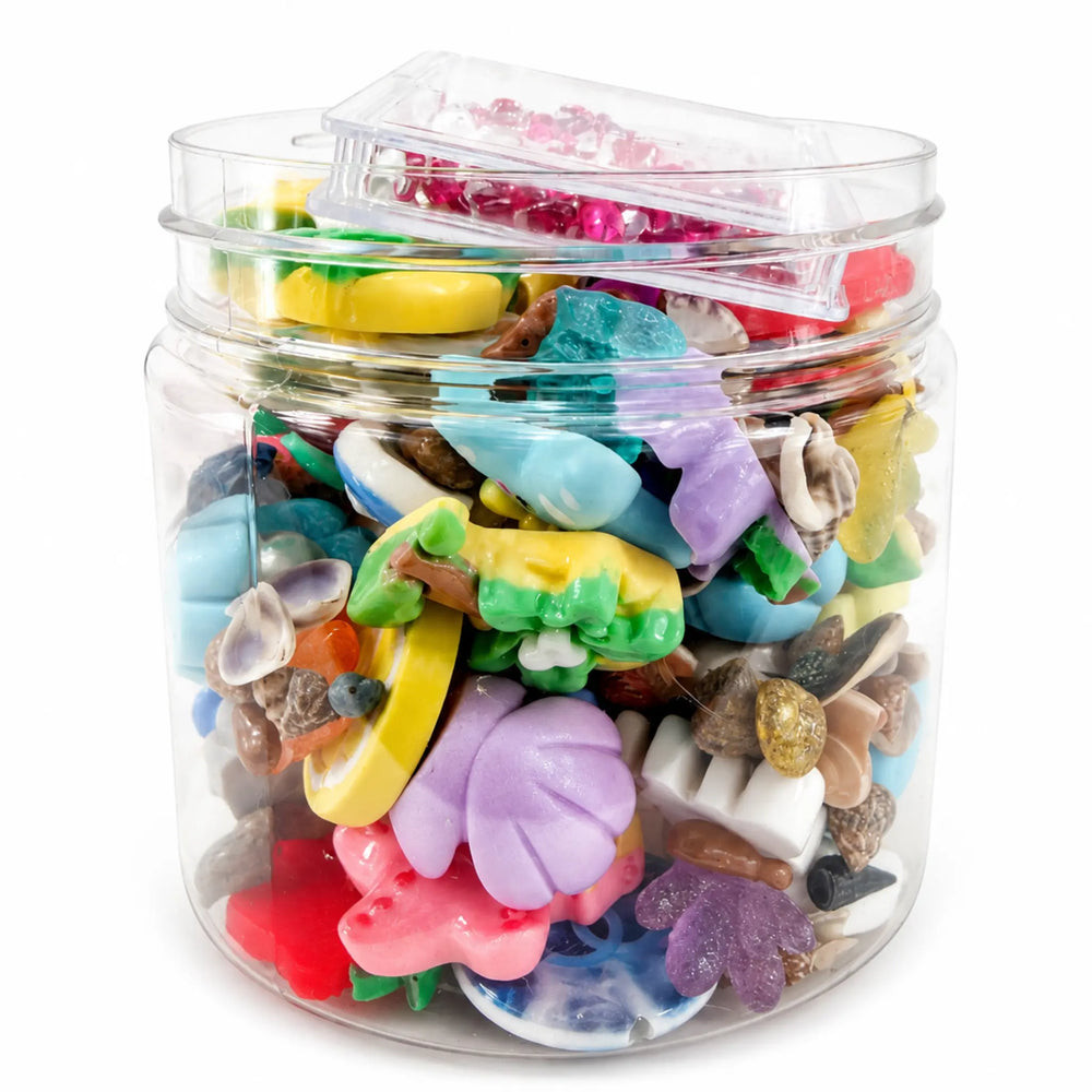 Assorted tropical craft embellishments featuring flowers, sea shapes, cabochons and miniature shells