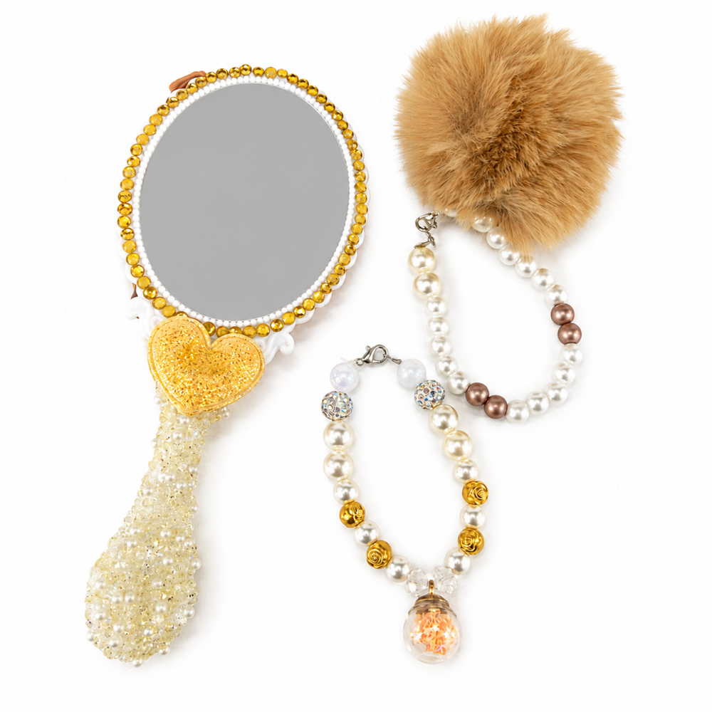 Back view of decorated hand mirror with gold rhinestone trim, pearl details and matching beaded accessories