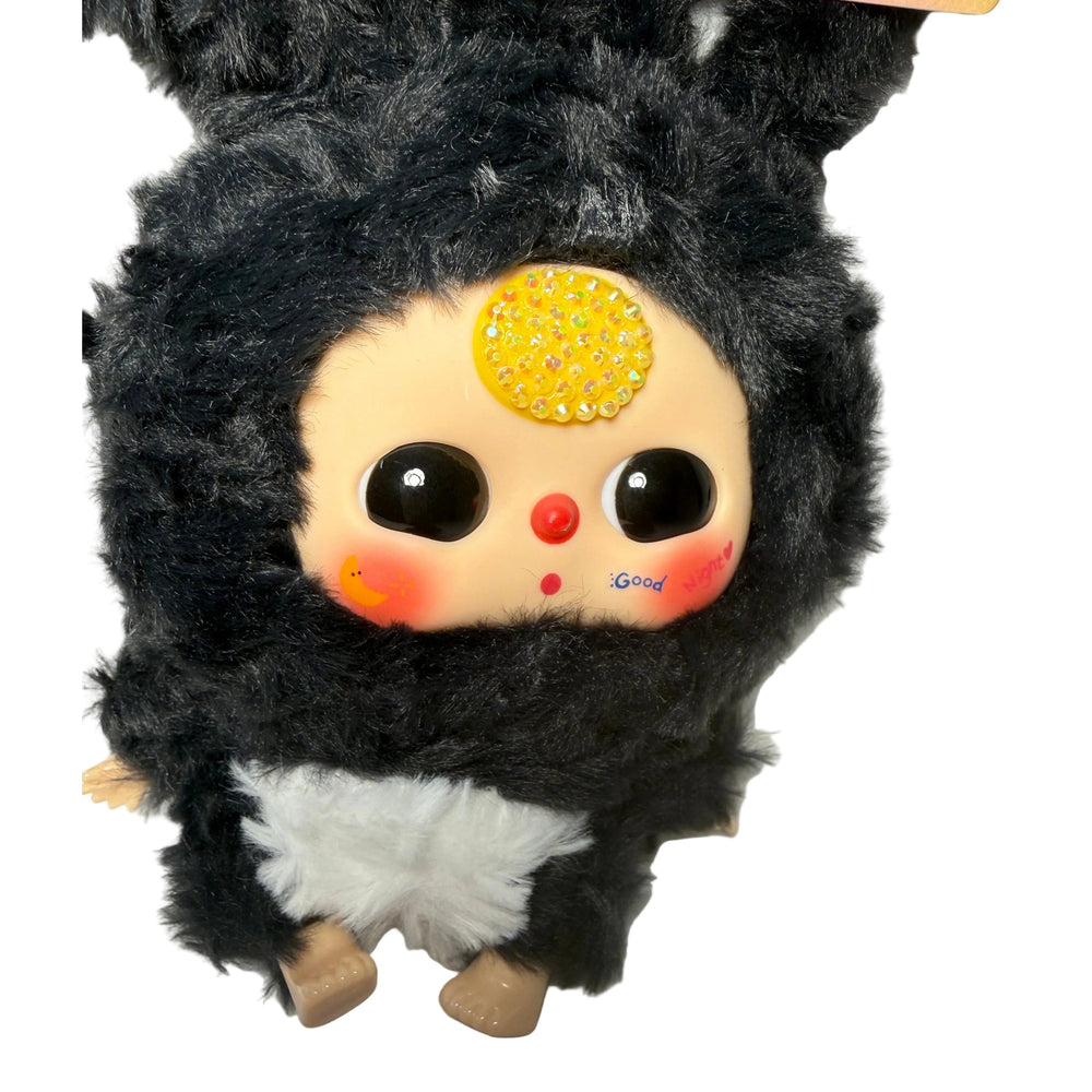 Close-up of Baby Three Black & White plush doll showing hand-applied crystal bedazzled details — luxury kawaii collectible"