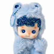 Close-up of Hacipupu Blueberry plush pendant showing sparkling blue crystal details, soft fur and blue eyes.