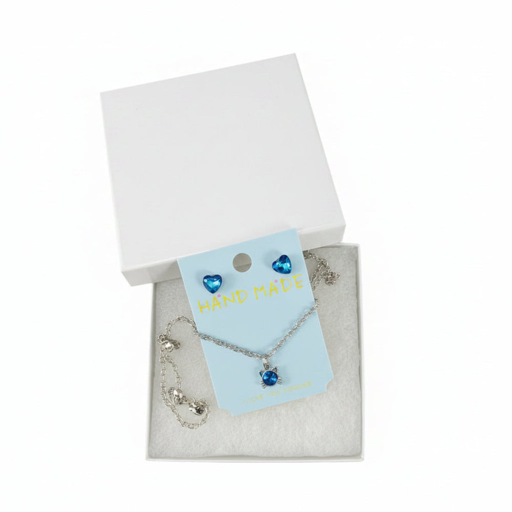 Close-up of blue crystal heart stud earrings with sparkling heart design