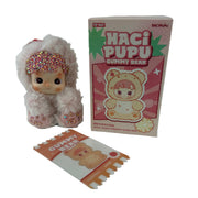 Close-up of peach flavor crystal bedazzled details on Hacipupu Peach Gummy Bear Series vinyl plush collectible