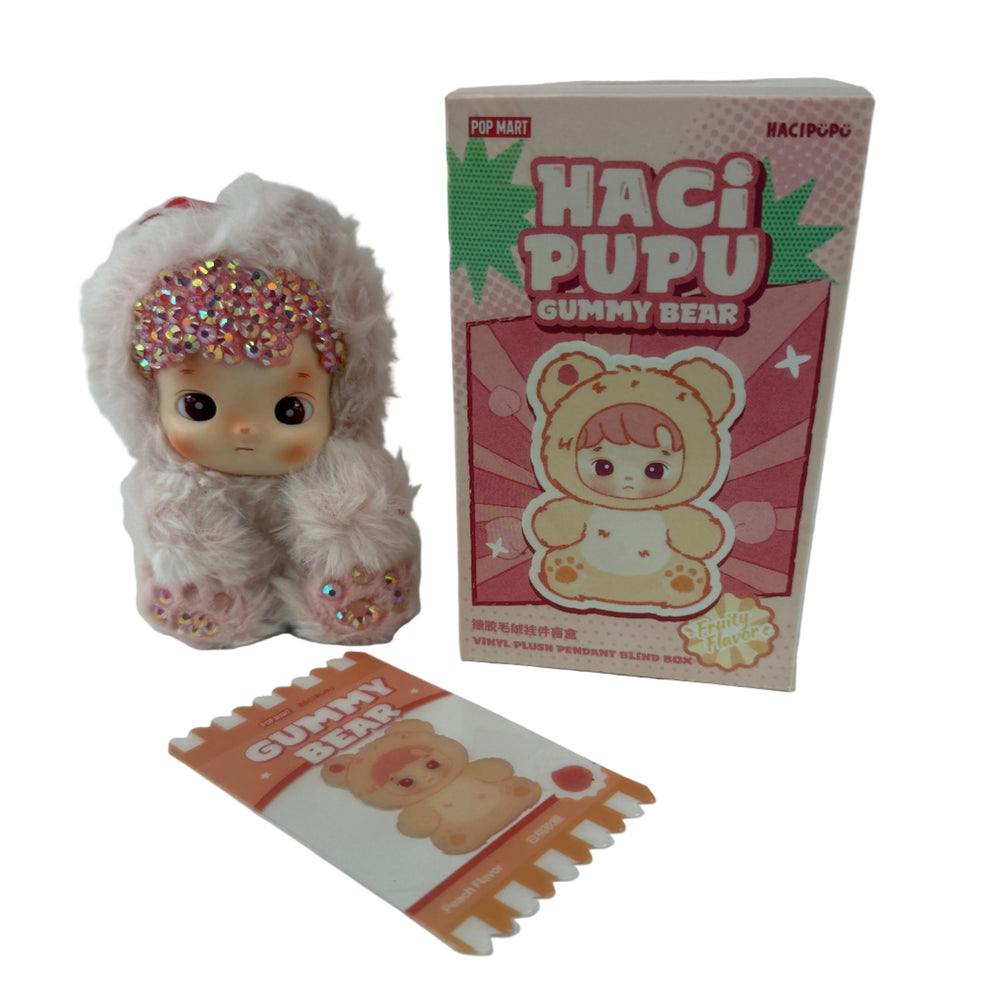 Close-up of peach flavor crystal bedazzled details on Hacipupu Peach Gummy Bear Series vinyl plush collectible