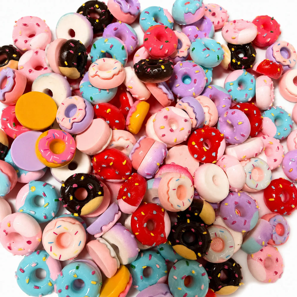Colorful donut flatback charms with icing and sprinkles for jewelry making and DIY crafts.