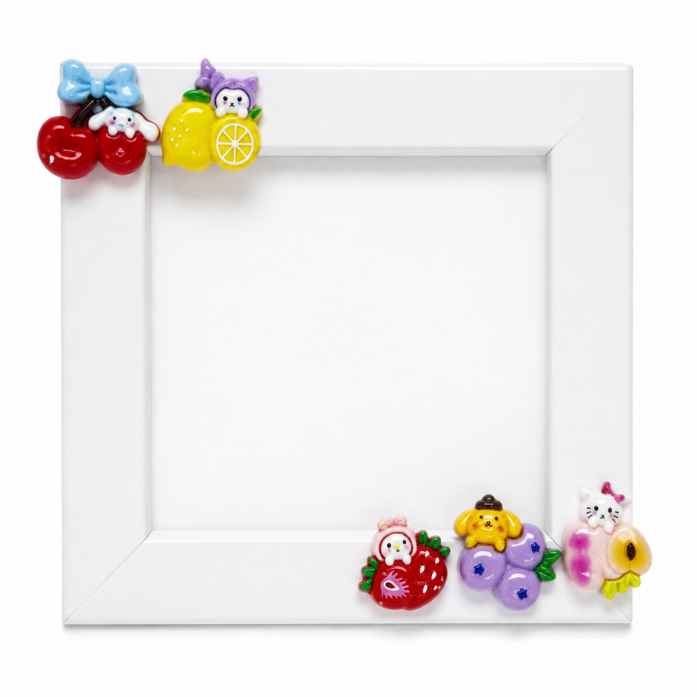 Colorful fruit character resin flatbacks decorating a white picture frame
