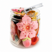 Colorful mixed craft embellishments with retro-inspired flatback and jeweled decorations