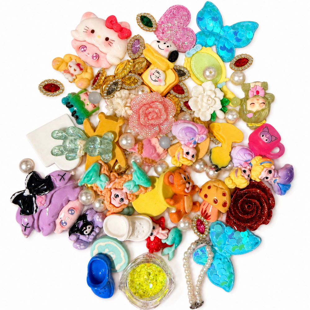 Colorful princess and mermaid DIY craft mix with flatback charms, glitter flowers, faux pearls and jeweled embellishments.