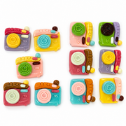 Colorful resin camera flatbacks showing example assortments for the 5-piece and 6-piece random-pick options.