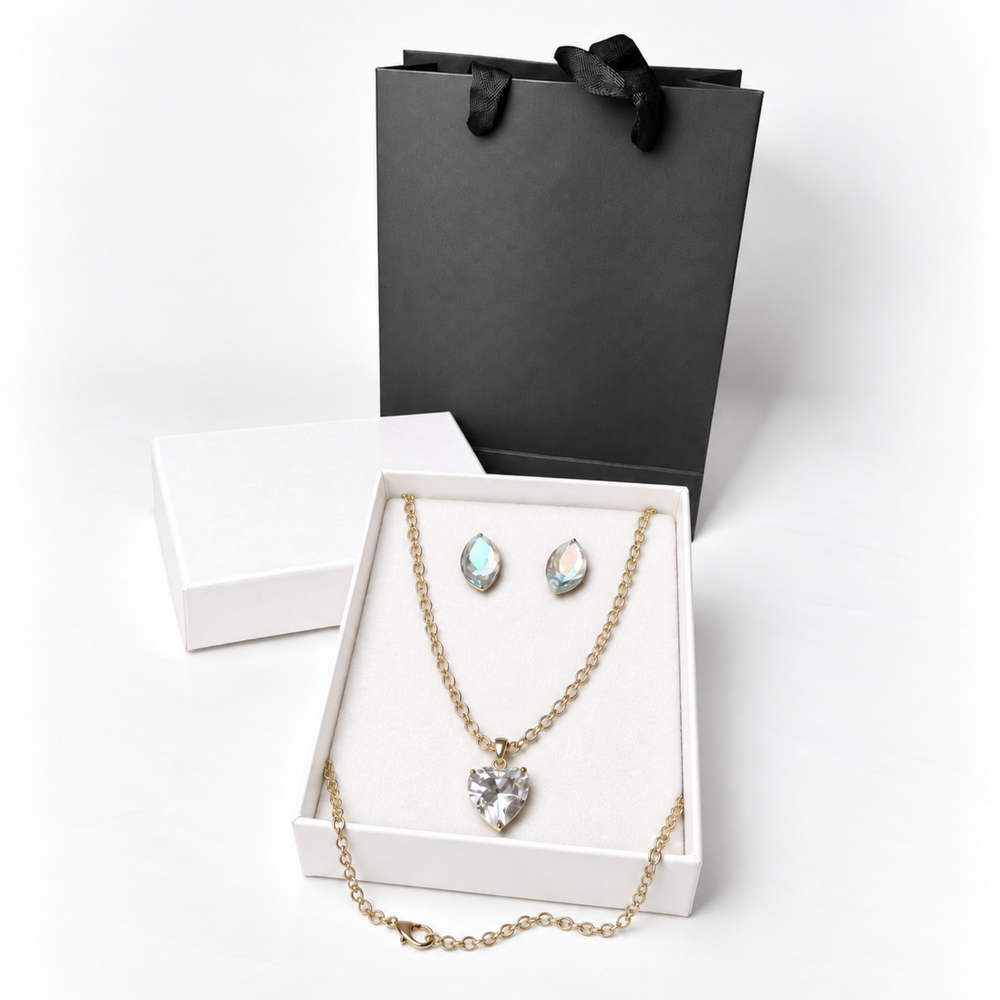 Crystal necklace and earring gift set presented in a white jewelry box with a black premium gift bag.