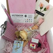 Curated retro gift basket for her with pink stationery, crystal heart jewelry, pH lip gloss, rose soap, and 80s mirror