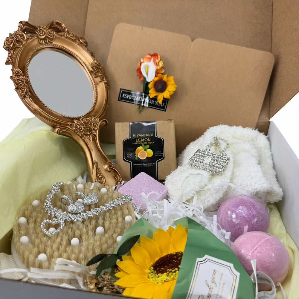 Curated self-care gift box for women featuring rose bar soap, bamboo scrubber, jewelry, and spa essentials