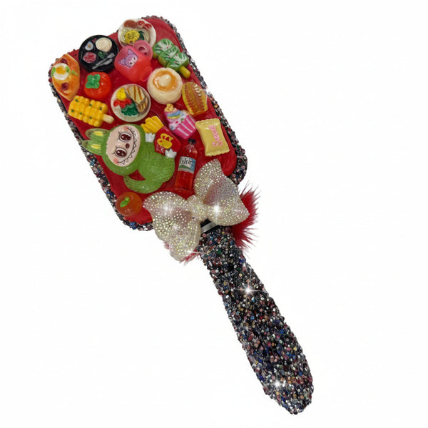 Decorated hairbrush with colorful fruit and food charms, red round accent and white bow