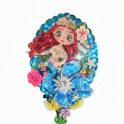 Decorated mirror showcasing a mermaid example made of flexible porcelain