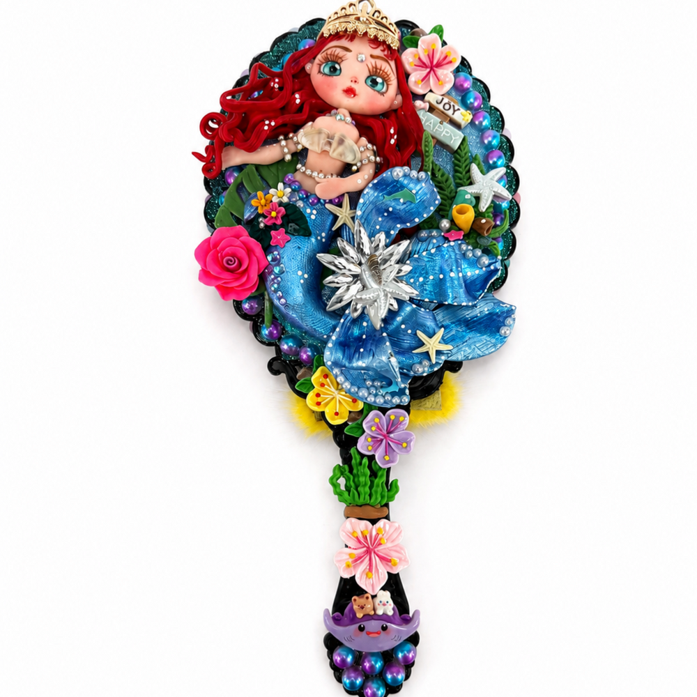 Decorative mermaid hand mirror with blue tail, colorful beads, flowers and dimensional ocean embellishments