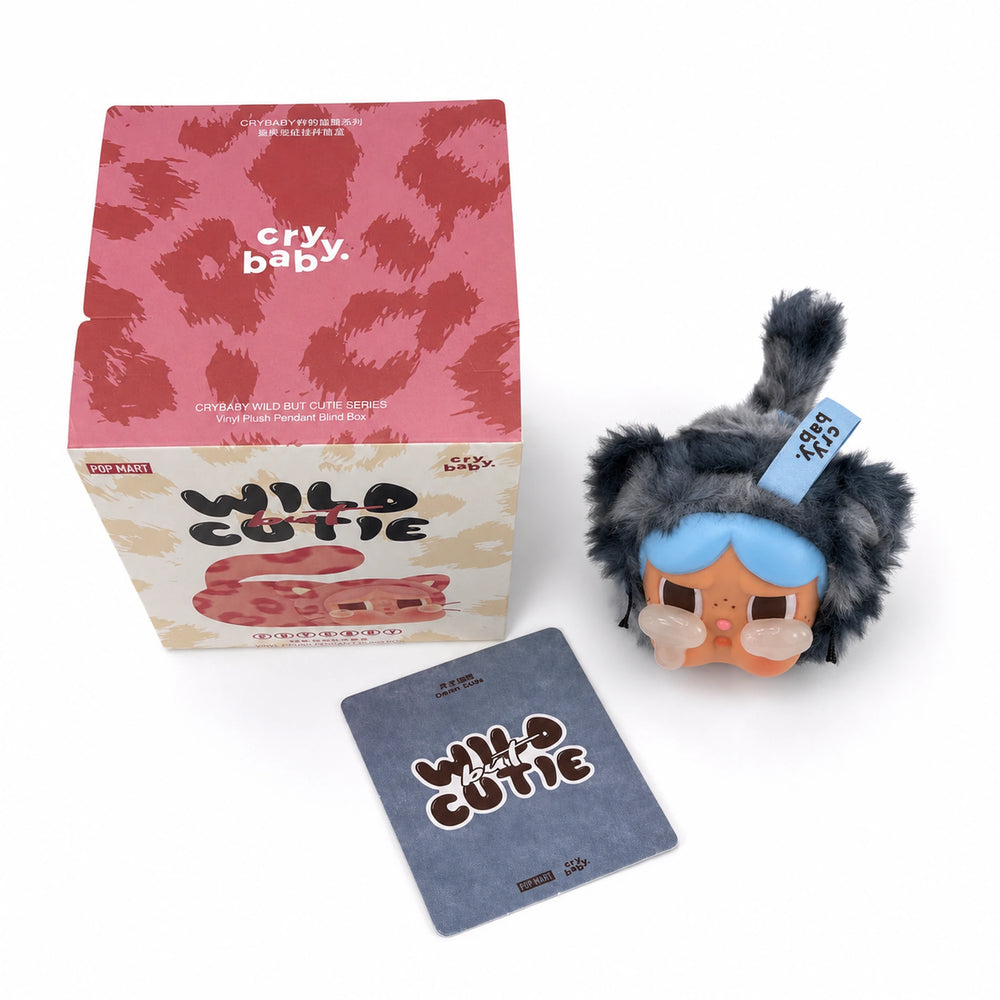 Denim Cutie Crybaby plush pendant collectible with blue-gray hood and packaging