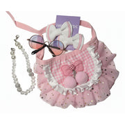 Detailed view of a fluffy pink dog tutu skirt and boutique hair bows, part of a coordinated 4-piece pet accessory set