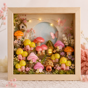 Fairy garden vanity mirror with colorful mushroom decorations and delicate flower accent