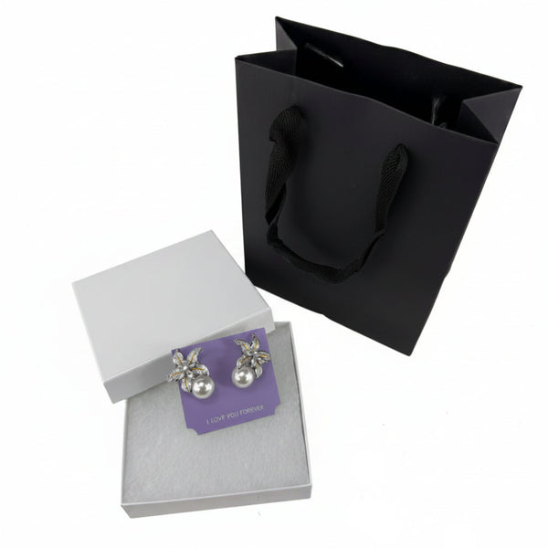 Faux pearl flower earrings with crystal petals in gift bag — elegant boutique jewelry gift for women