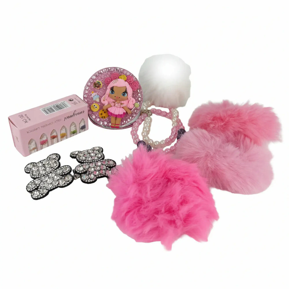 Flat lay of women's beauty gift set with bear hair clips and compact mirror