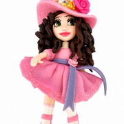 Flex porcelain fashion doll in pink glitter dress and floral hat on white background