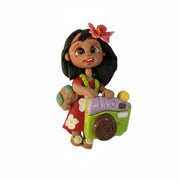 Flexible porcelain craft embellishment featuring a cute tropical girl with green camera, backpack, and tan skin tone