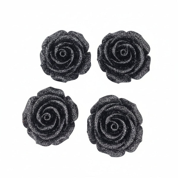 Four black glittery rose-shaped stud earrings arranged in a 2x2 grid on a plain white background.