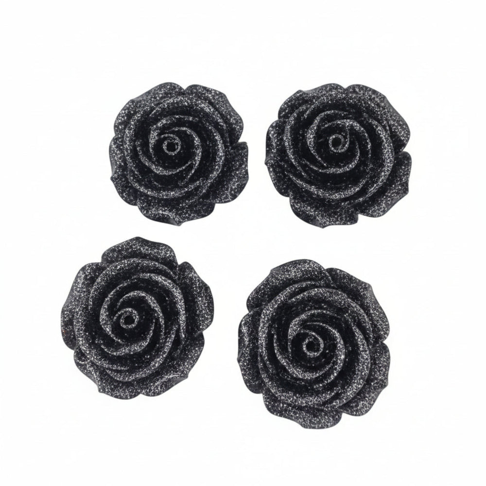Four black glittery rose-shaped stud earrings arranged in a 2x2 grid on a plain white background.