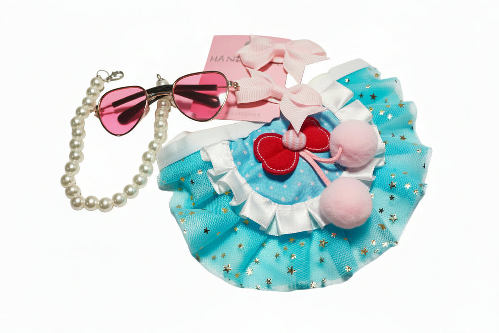 Full 4-piece princess pet set: blue cherry tutu, pink pearl collar, heart sunglasses, and bows.