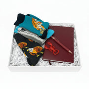 Gift set for men with tiger socks, red lobster opener, and burgundy notebook in a white gift box