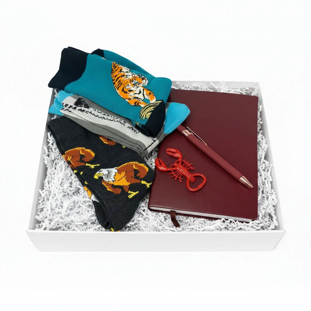 Gift set for men with tiger socks, red lobster opener, and burgundy notebook in a white gift box