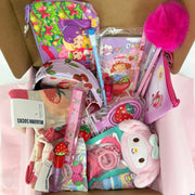 Girls' strawberry beauty & accessory bundle: lip gloss, hair ties, and plush keychain in a gift box.