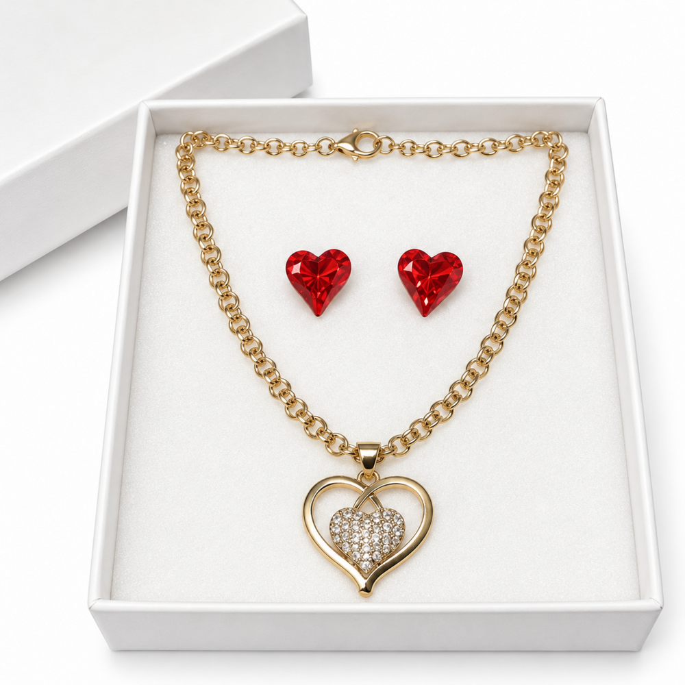 Gold-tone double-heart necklace with sparkling rhinestones and red crystal earrings presented as a jewelry gift set.