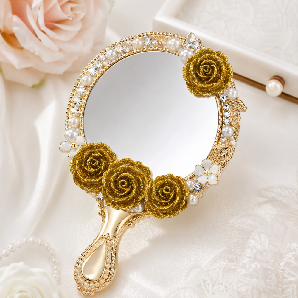 Gold glitter rose cabochons used to decorate an elegant handheld vanity mirror with pearls and rhinestones