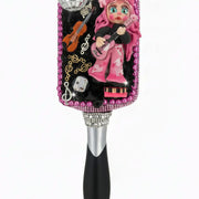 Hairbrush with handmade country singer porcelain doll holding guitar, front view