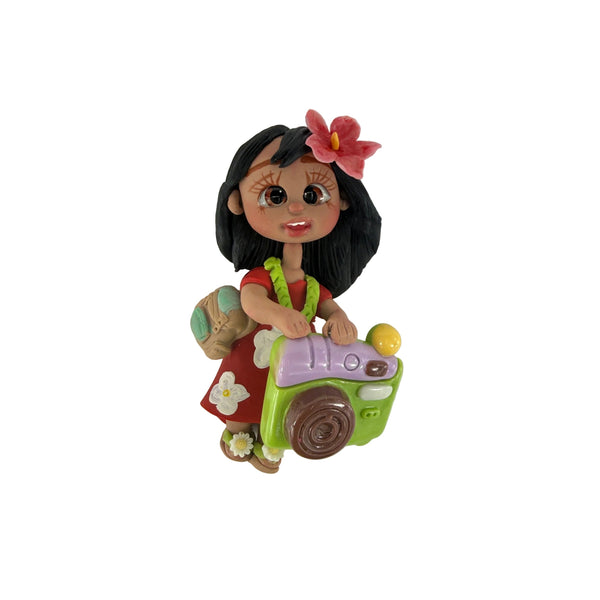 Handmade flexible porcelain tropical girl explorer doll charm with red dress, hibiscus flower, and travel backpack