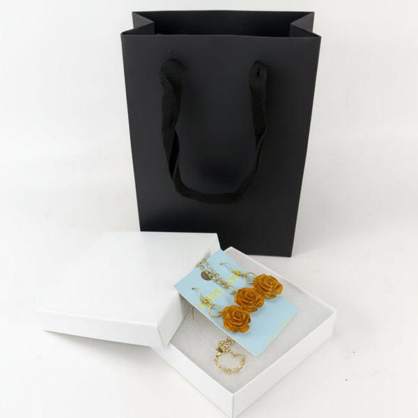 Handmade rose jewelry set with matching earrings and necklace displayed in a white jewelry gift box.