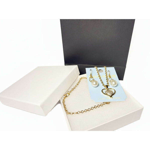 romantic jewelry gift set with heart necklace, pearl earrings, white jewelry box, and black gift bag.