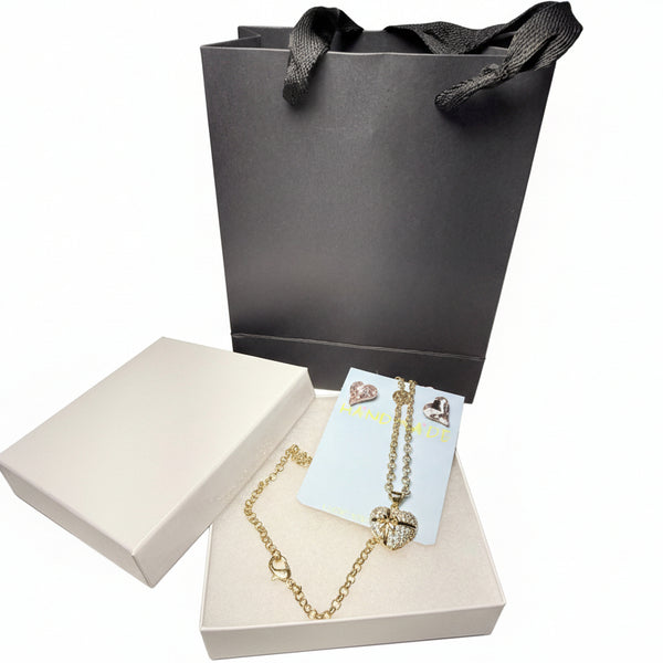 Gold necklace heart pendant, crystal rose earrings with a black gift bag in white jewelry box