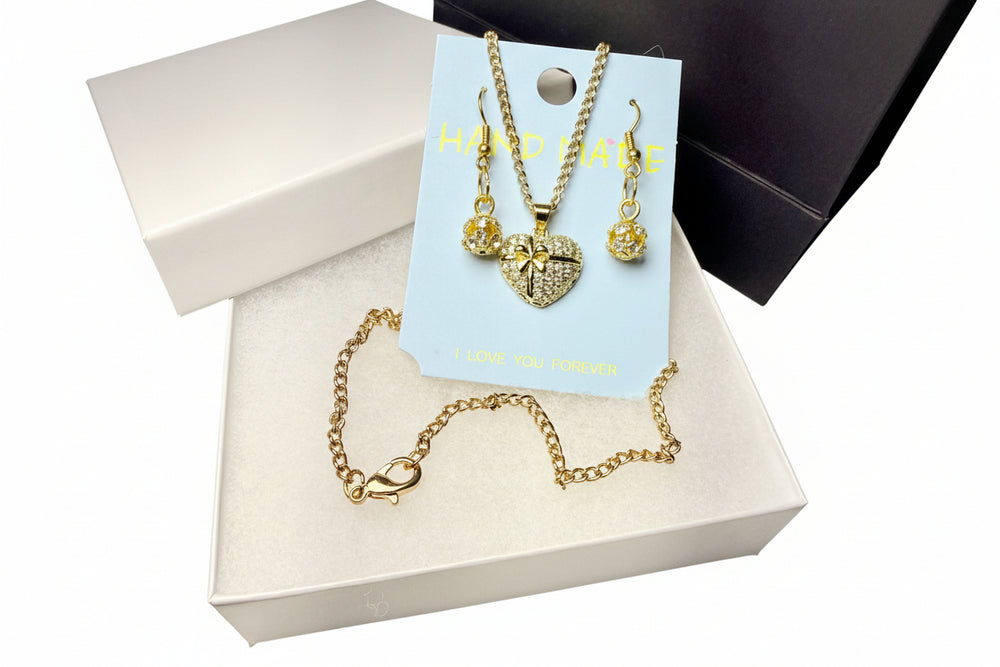 Close-up of a sparkling rhinestone heart pendant on gold-tone chain, handcrafted jewelry for romantic gifts.