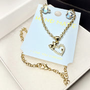 Romantic jewelry gift set with a rhinestone heart necklace, crystal teddy bear earrings, premium white box, and black gift bag.