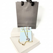 Handmade crystal necklace and earring set on a display card with a premium gray gift bag and white jewelry box.