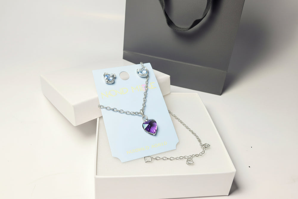 Silver-tone crystal necklace and earring jewelry set in a white gift box with a luxury black gift bag