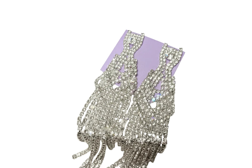 Close-up of sparkling rhinestone dangle earrings featuring a brilliant cascading crystal design for formal events