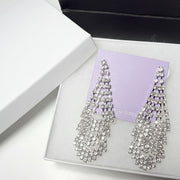 Elegant jewelry gift set presentation with sparkly rhinestone earrings and high-quality gift packaging