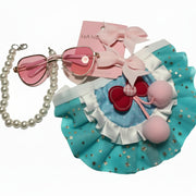 Detailed blue and pink tutu skirt with cherry patches and pom-poms for small dogs.