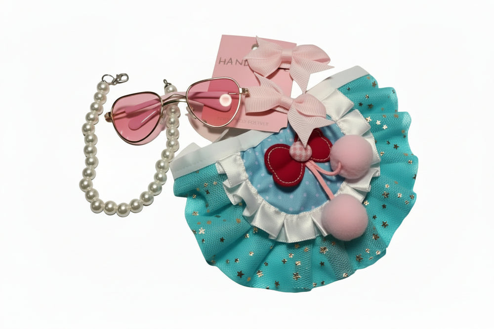 Detailed blue and pink tutu skirt with cherry patches and pom-poms for small dogs.