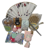 Luxury teal and gold spa gift basket for women featuring a designer hand fan, aromatic candle, bath bombs, and a ceramic bowl set in a premium birthday arrangement.