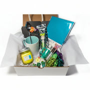 Kawaii teal gift box for women with journal, mug, candle and accessories