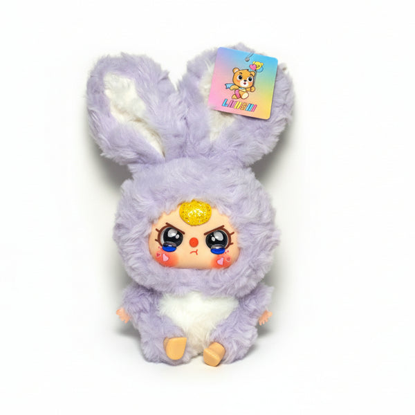 Medium-sized mad face Baby Three plush doll (25cm) from the Crystal Bedazzled series, featuring a purple and white bunny body with a vinyl face and sparkling crystal details.